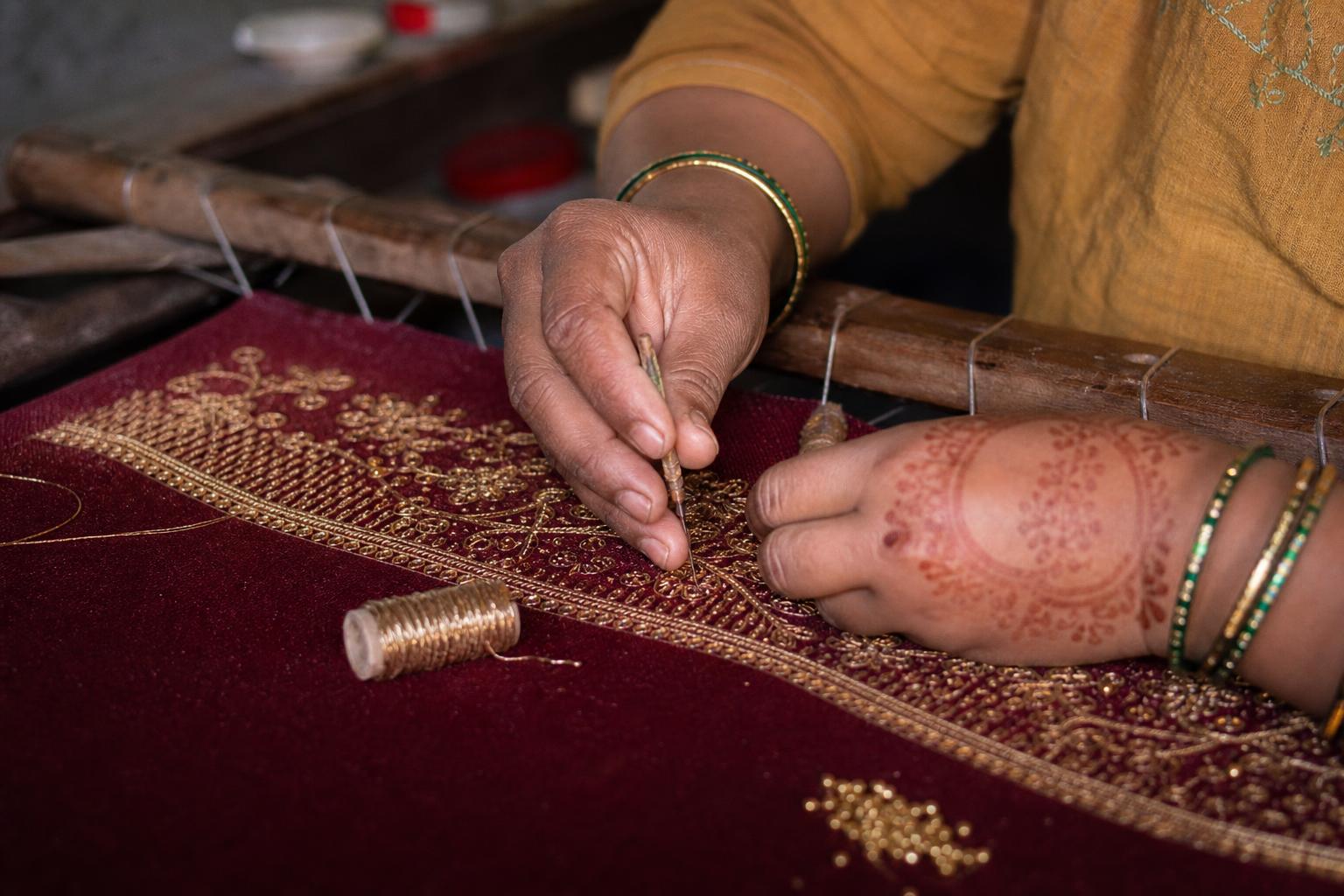 Zardozi hands at the adda frame